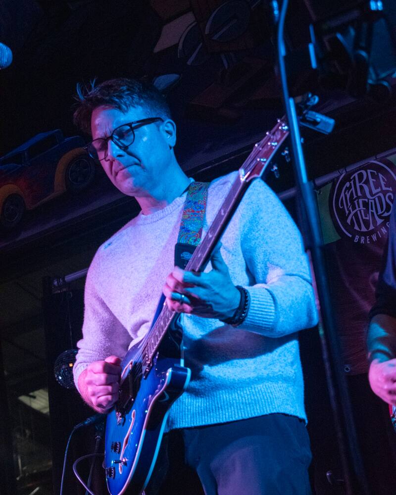 Miles McHugh playing guitar